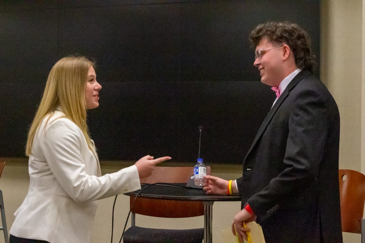 Speaker of the Senate Kylee Hower talks with Aiden Powell, student organizations director, after the first presidential debate on March 20. Hower is running for student body president with Matthew Phan, engineering senator, for vice president. Powell is running for president with Diana Grajeda, current leadership and engagement Director, as vice president.