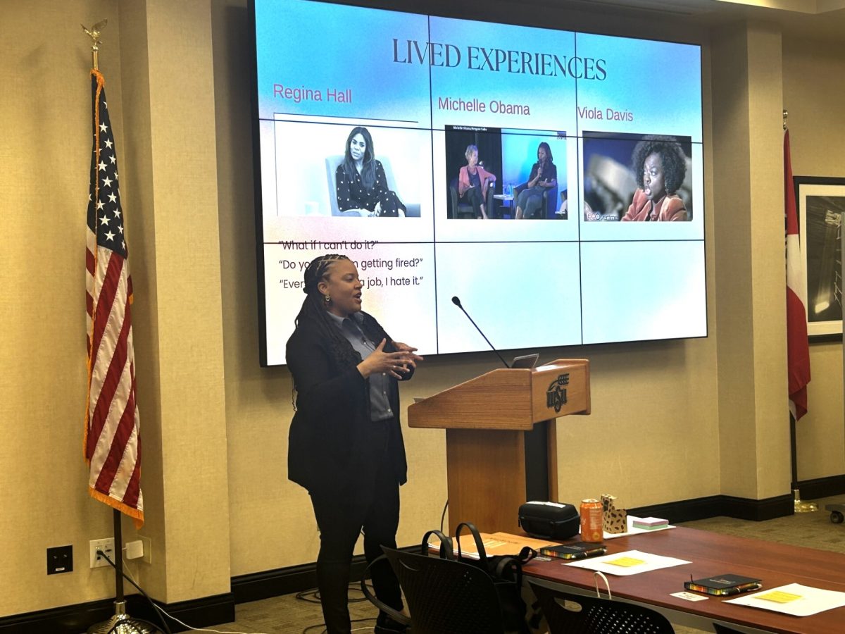 Latasha Kelly speaks on imposter syndrome while visiting Wichita State University. Kelly showed a video of Michelle Obama, who said that she has often asked herself whether she was good enough to be first lady.
