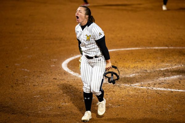 Junior Allison Cooper screams after striking out a player during the top of the 7th inning against OU.