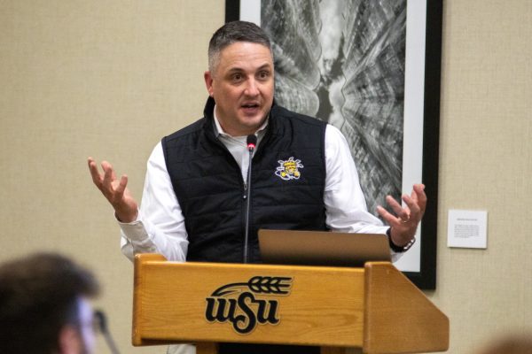 WSU Director of Athletics Kevin Saal speaks to Student Senate members about the academic success of student athletes and survey results of the student athlete experience. Saal was joined on the Wednesday night meeting by Clayton Stoldt, the associate dean of applied studies.