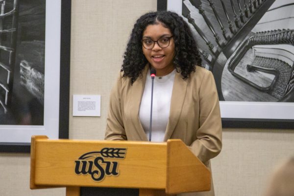 Student Body President Iris Okere speaks in favor of the Thanksgiving Break Act, which would remove fall break and extend Thanksgiving break by two days. The act was denied after more than half of the Student Senate voted in opposition of the act.