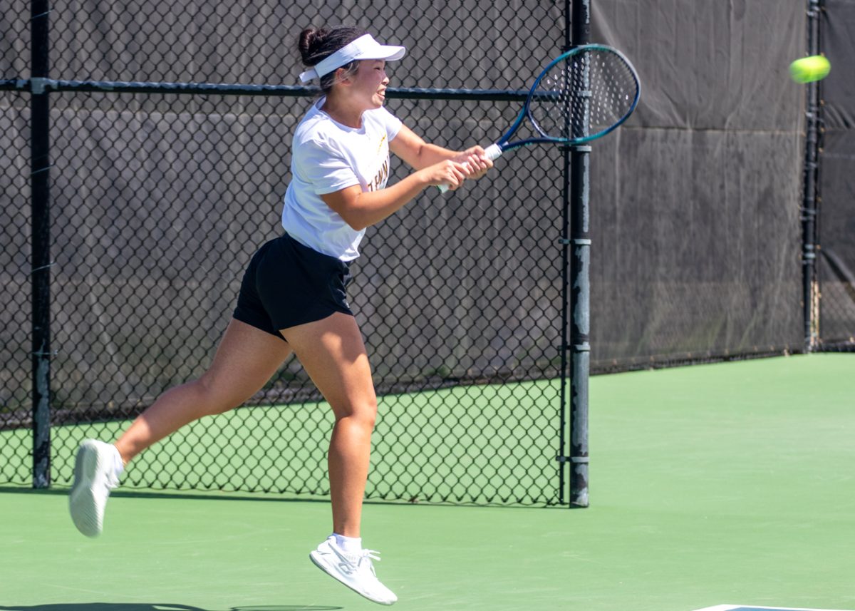 Freshman, Xin Tong Wang on the court to play against Tulsa at the Coleman Tennis Complex. Wang won her tenth singles match on April 8, with the score of 6-4, 6-2, on court two.