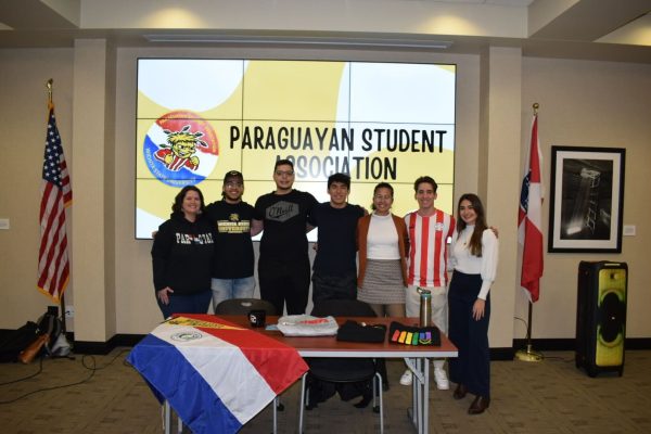 Members of the Paraguayan Student Association smile for a photo during a general meeting. Photo courtesy of Paraguayan Student Association.