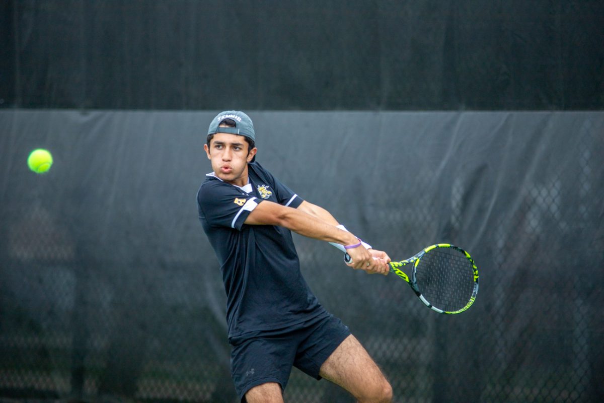Alejandro+Jacome+swings+his+racquet+at+the+ball+during+a+match+against+Tulsa+on+April+6.+Jacome+is+a+sophomore+at+Wichita+State.