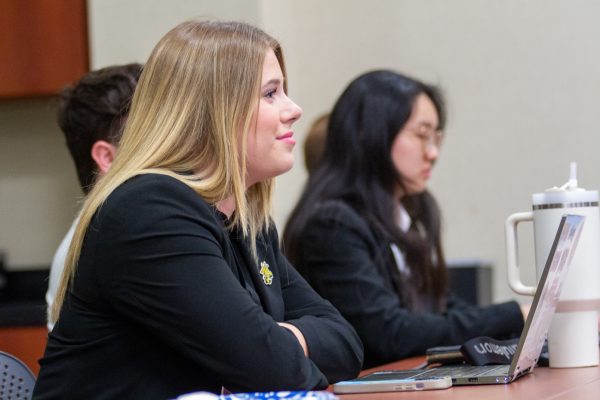 Student Body President Kylee Hower listens to speaker of the senate nominees during Wednesday night's Senate meeting.