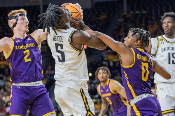 Lipscombs AJ McGinnis defends Wichita States Isaac Abidde during a game in November 2023. McGinnis committed to transfer to Wichita State over the weekend. 