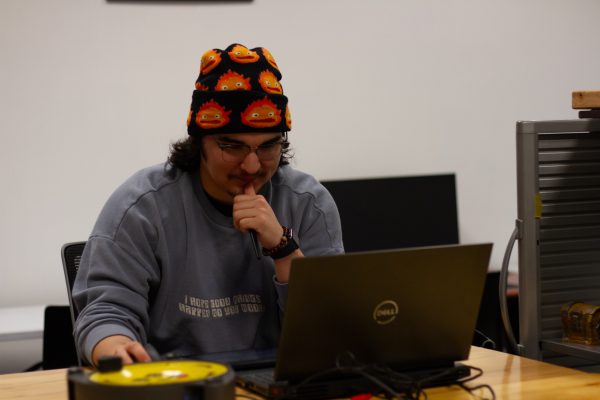 Takota Jay, senior animation major, works on his coursework. Jay also does intramural sports and plays for the Shocker Sound Machine at Wichita State.