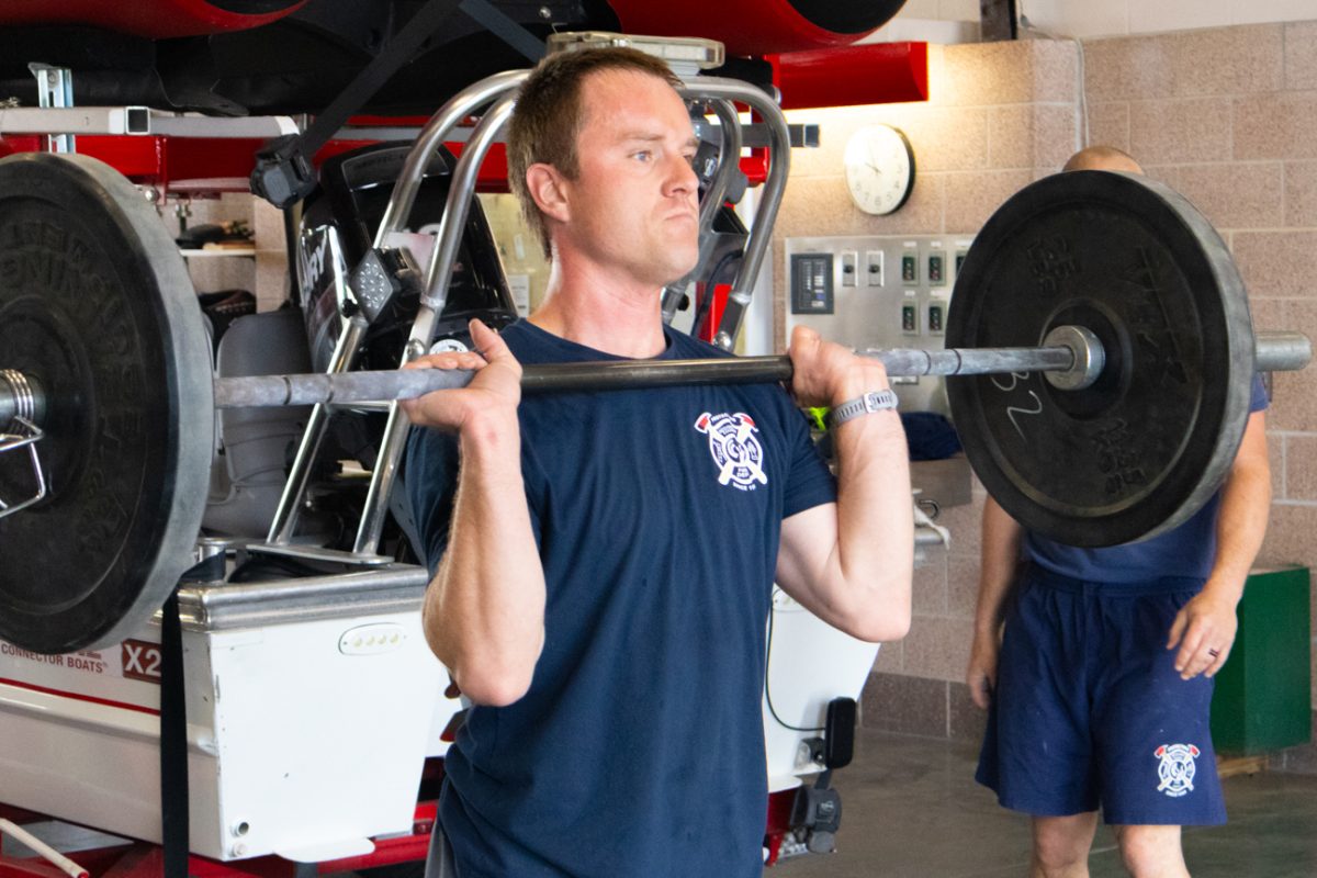 Firefigher Austin Morrow lifts weights during a morning workout at Station 32 on April 19.