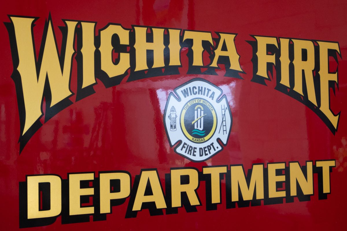 The emblem of the Wichita Fire Department (WFD) on the back of a fire truck is on every WFD fire vehicle.