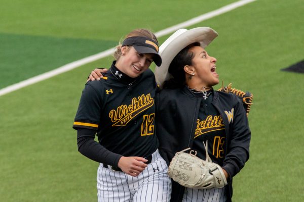 Avery Barnard and Madyson Espinosa skip back to the dugout during Wichita States game against UAB on April 20.