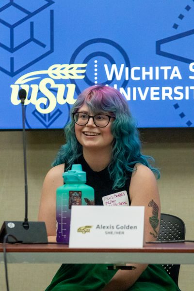 Alexis Golden smiles to the audience during the professionalism in the LGBTQIA+ community panel hosted by ODI and Shocker Career Accelator. Golden is an advocate supervisor at Court Appointed Special Advocates in Sedgwick County.