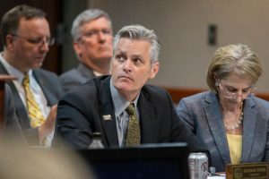 Wichita State University President Richard Muma listens as other university representatives present on behalf of their universities at a Kansas Board of Regents meeting on May 15.