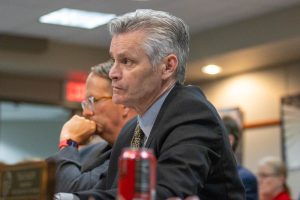 Wichita State University President Richard Muma listens at a Kansas Board of Regents meeting hosted in May. 