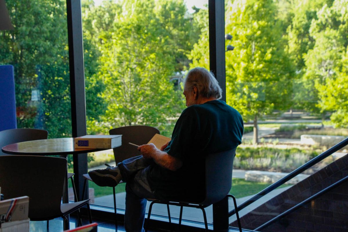 Ralph Rampey, a former WSU student, reads Shelby Foote's Civil War books after attending the Wichita Art Museum's book sale for the first time. Rampey was extremely impressed with their selection of historic literature. 