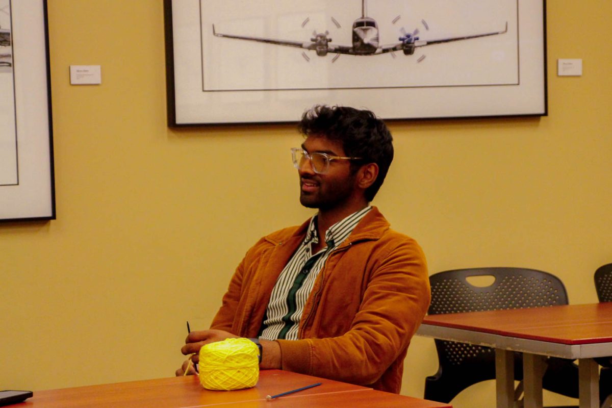 Dimitri Seneviratne sits down with a reporter, reliving how he became a member of the Threads Club. Although the attendance was low during this particular meeting, Seneviratne believes more people will join as the club becomes more popular. (Photo by Kaitlynn Peres / The Sunflower)