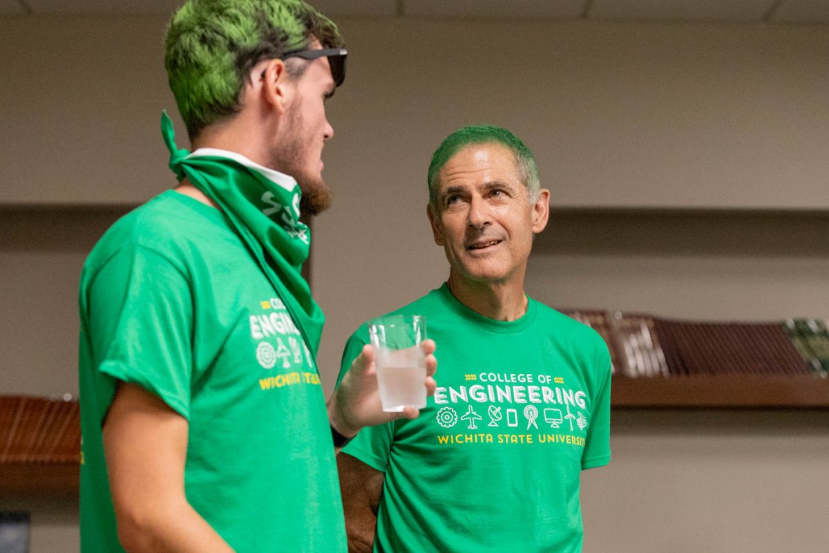 Anthony Muscat, the dean of the College of Engineering, talks to a student at the Pre-Party on Aug. 23. Muscat will leave WSU in June.
