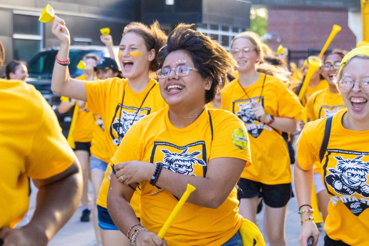 Fairmount College of Liberal Arts and Sciences students run into Cessna Stadium on Aug. 23 for the 10th annual Clash of the Colleges.