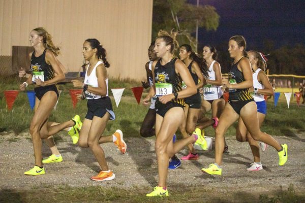 Freshmen Kalyn Willingham and Emily See run in a pack with sophomore Isabelle Hartnett during Friday's season-opening cross country meet. WSU head coach Kirk Hunter said he wanted Hartnett, one of the lone experienced Shocker runners in the meet, to pull the younger runners with her to a better finish.