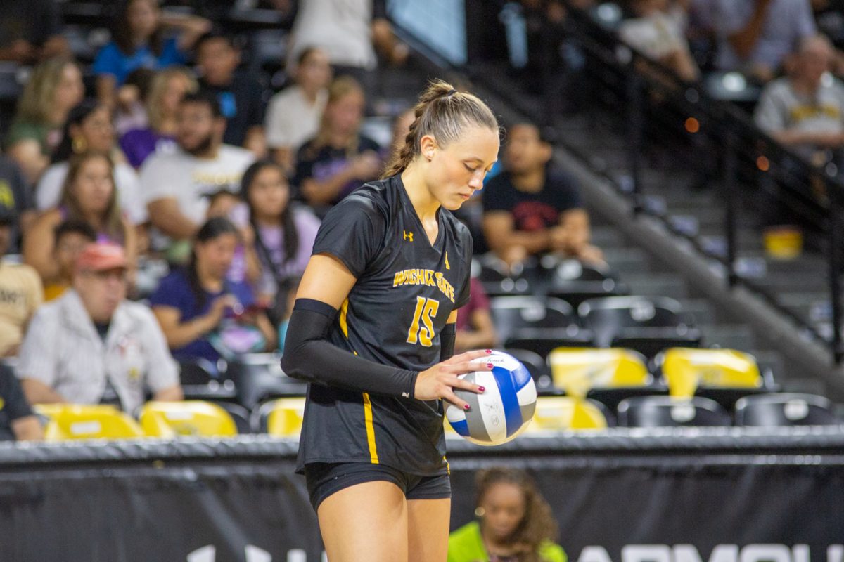 Senior middle blocker Morgan Stout holds the ball during the exhibition game against Kansas State on Aug. 24.