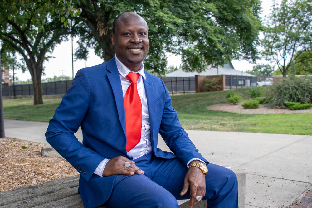 Ibrahim Ibn Ibrahim, the author of "The Bravest American," smiles for a photo. Ibrahim wrote the book as a testament to “the daily battles, triumphs, and the unyielding spirit” of ordinary individuals.