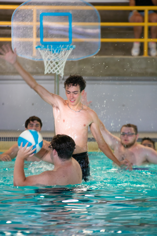 Freshman Seth McCleave jumps up to block his opponent from shooting the basketball. The party's basketball game lasted continuously through the entire event. 