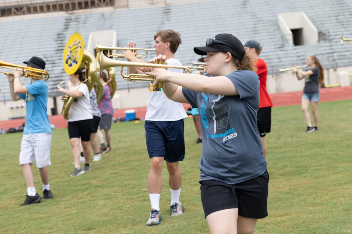 Student practices marching with the Shocker Sound Machine at band camp on August 13. The band camp was a week-long under the direction of Lucas Hulett, Director of Athletic Bands.