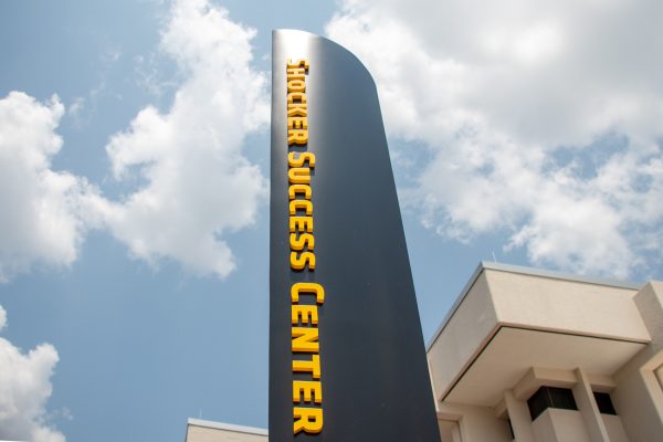 A pillar sign of the Shocker Success Center located at the building's south entrance. The Shocker Success Center is a newly renovated building on the main campus of Wichita State.