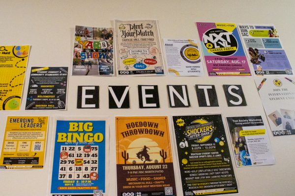 A wall of event calenders displayed in the Shocker Hall. Shocker Hall is one of two on-campus housing options for freshmen at Wichita State.