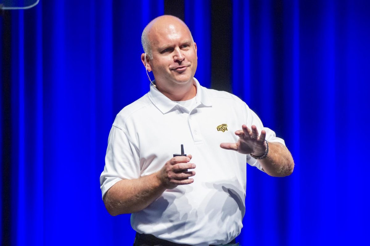 John Tomblin, who serves as WSU NIAR's executive vice president for research, industry, and defense program, speaks to attendees of the 2024 Fall Address. Tomblin talked about efforts to increase research at the university.