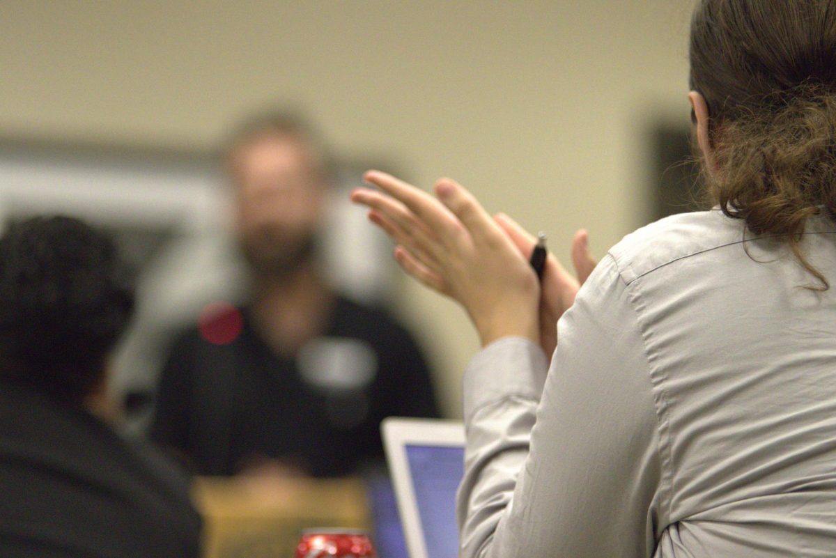 Honors Senator Ryan Nuckles rolls a pen between his hands during the Student Government Association meeting on Aug. 21.