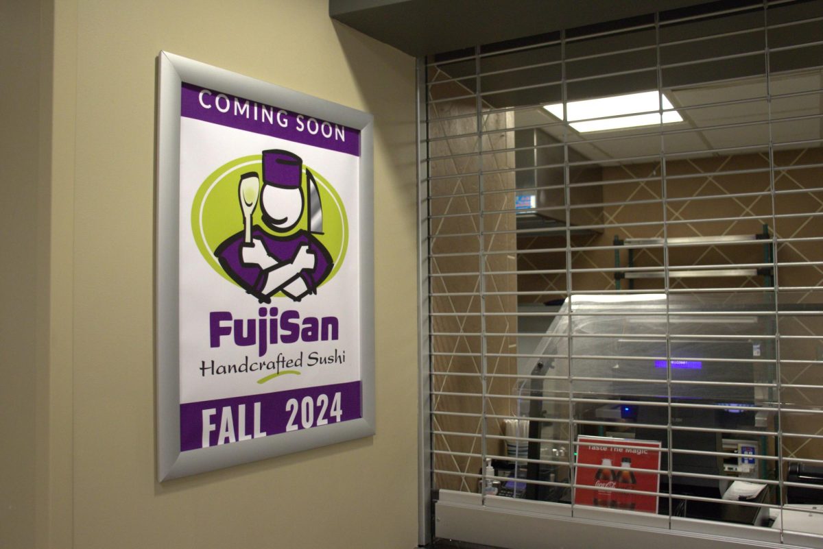 A poster promoting FujiSan Handcrafted Sushi hangs on the wall next to the soon-to-be-opened restaurant space. FujiSan replaced Tu Taco as this years Student Choice Concept.