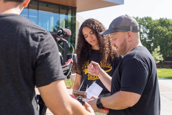 Kadrian Ayarza practices her lines in between takes for the show, "The College Tour." The show filmed students all over campus the week of Sept. 9.