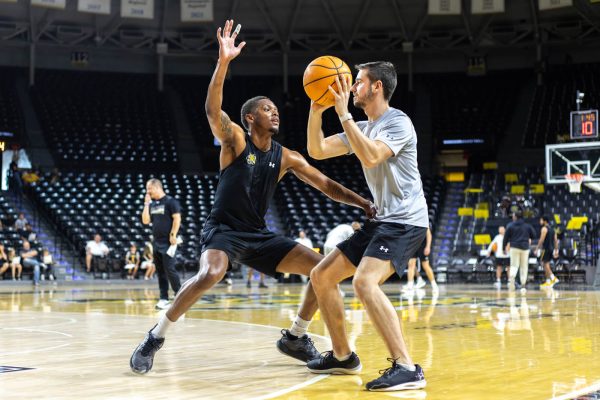 AJ McGinnis, a fifth-year guard, practices a defense drill. McGinnis spent the last two seasons at Lipscomb University.