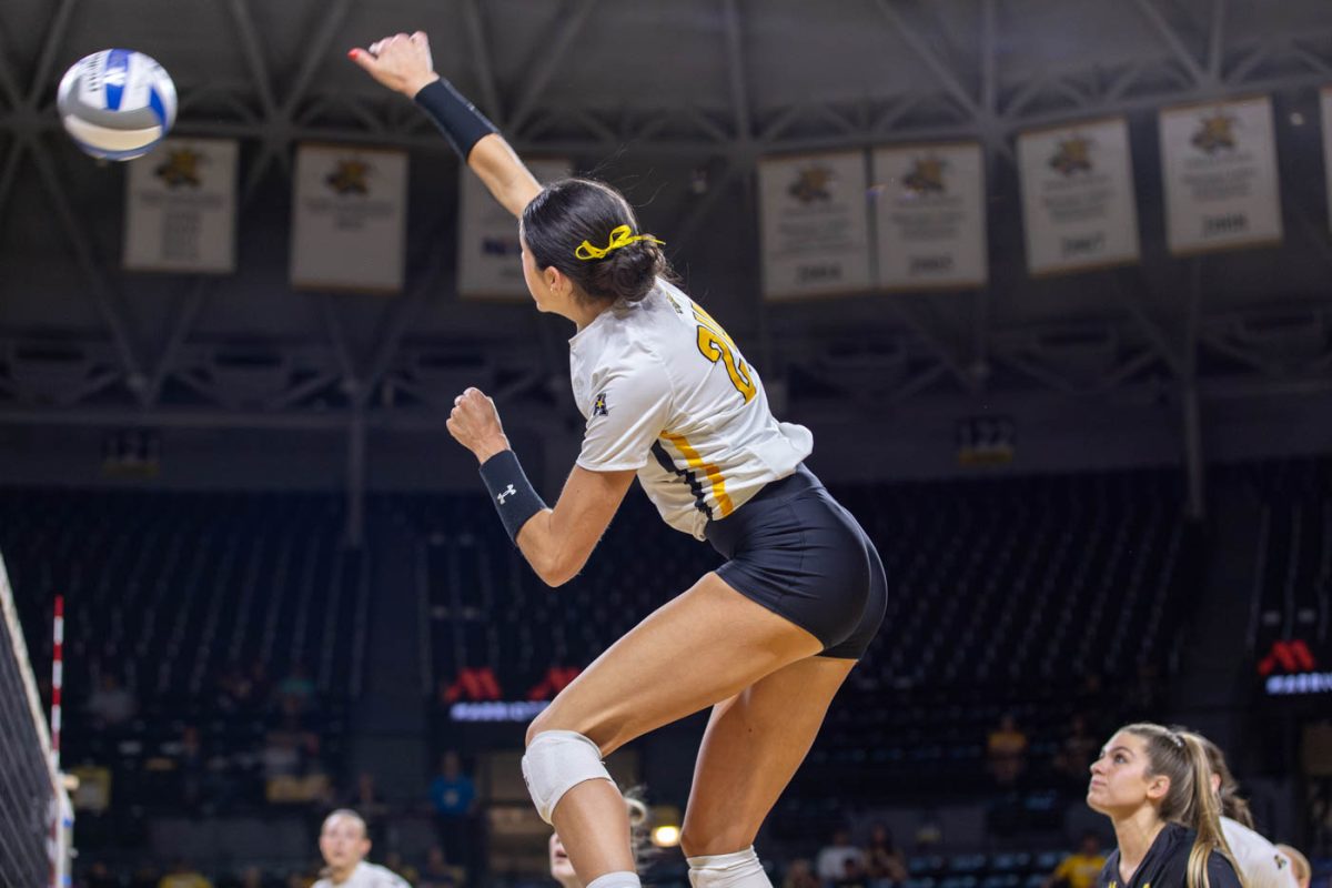 Alyssa Gonzales jumps for a left side kill on Sept. 27 against Temple. Gonzales made 17 kills and scored 17 points in the game.