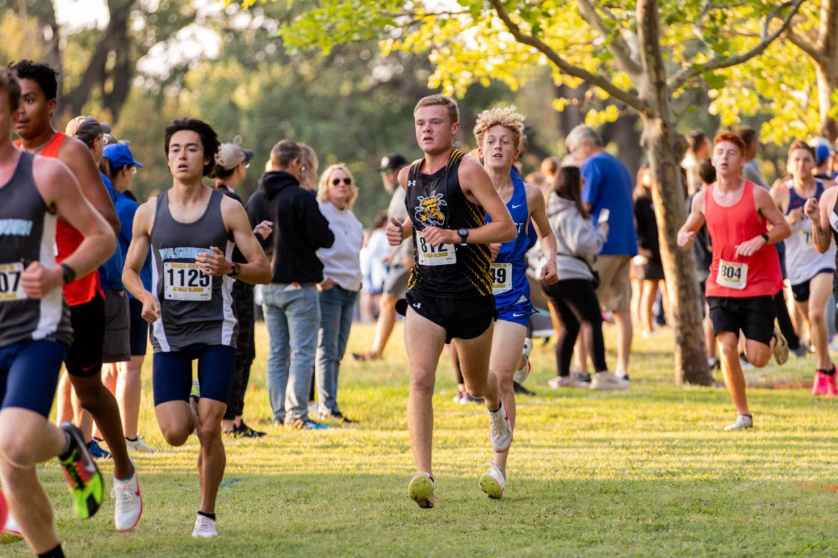 Junior Ian Hunter runs among the pack during the JK Gold Classic at Clapp Park. Hunter placed 61st out of the 130 men that ran on Sept. 7.