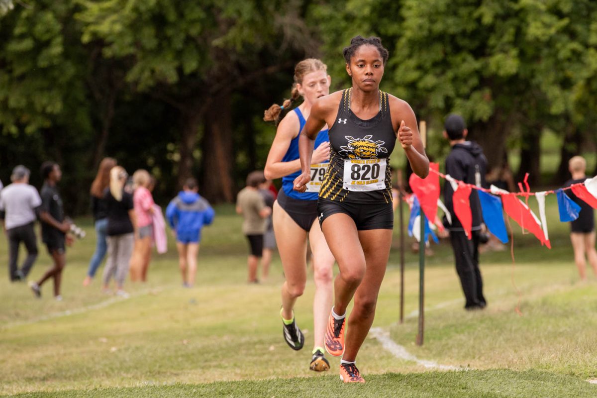 Senior Sarah Bertry runs during the JK Gold Classic race on Sept. 7. Bertry took sixth overall, and scored WSU six points in her first uniformed meet in two years.