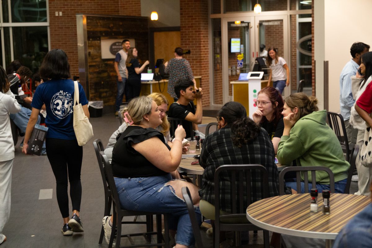 Wichita State University students find a place to sit with friends in the packed dining hall.