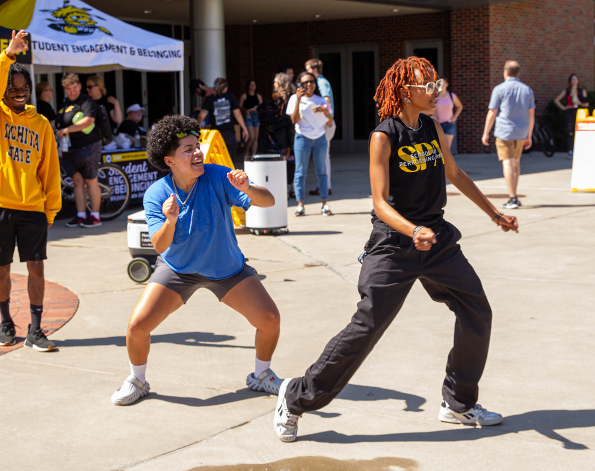 student tamia trotter and her fellow sigma gamma rho sisters dance along to music played at the involvement fair. to them, this was a chance to put a spotlight on how fun their sorority is.