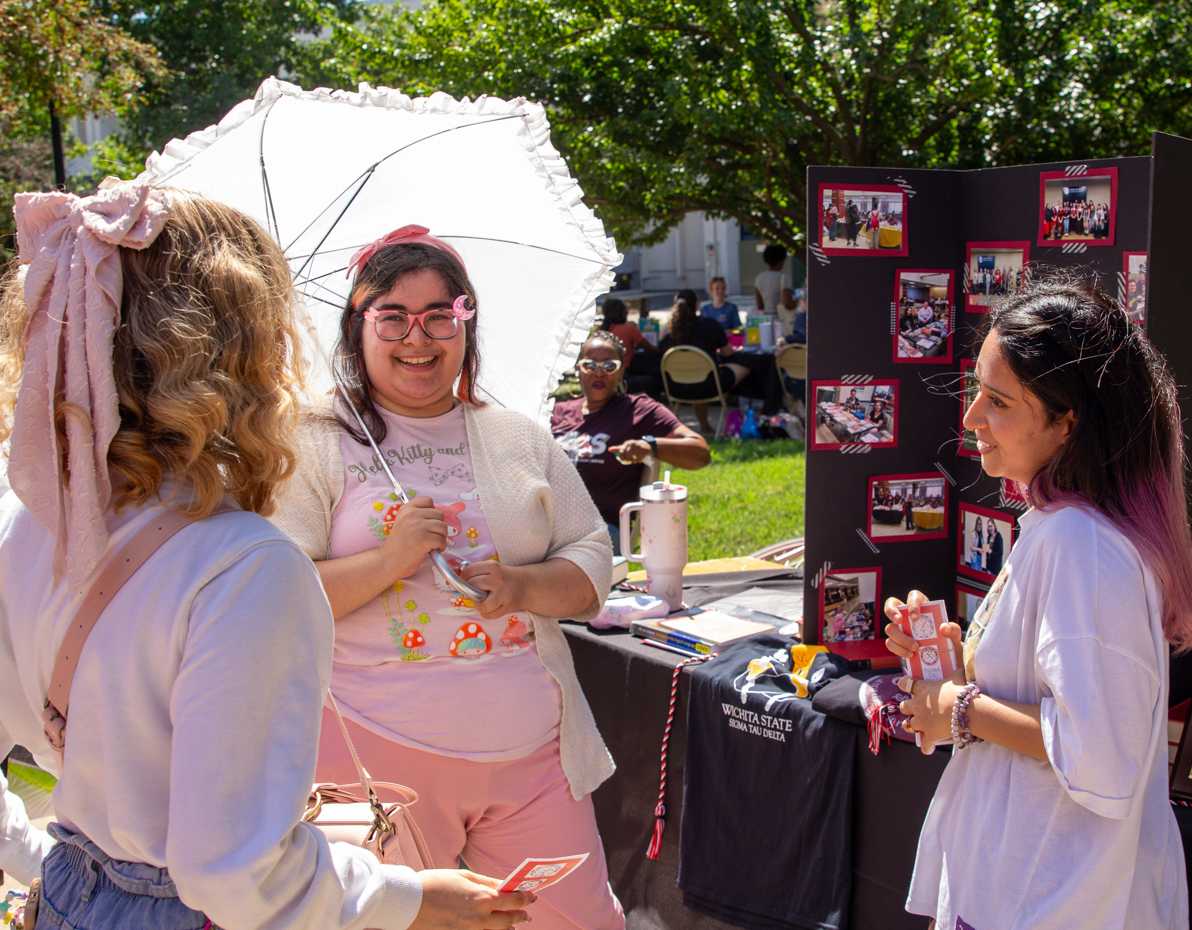 members of the sigma tau delta sorority tell interested student about their culture