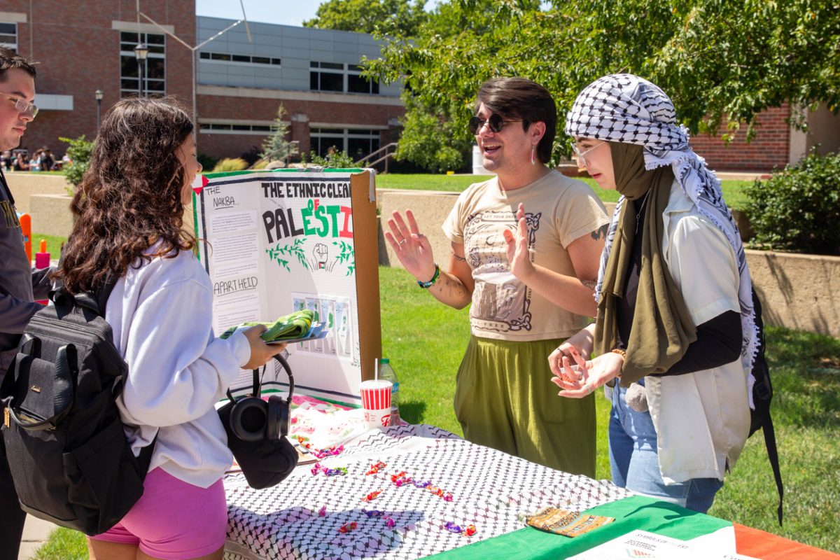 Members supporting Students for Justice in Palestine tell visitors about their efforts. 