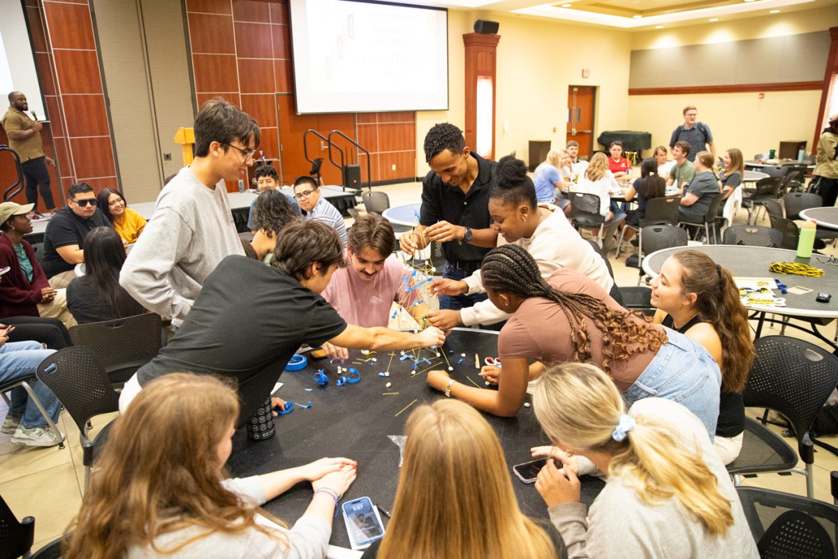 A group of students work together to construct a freestanding tower during the RSO Summit on Sept. 28. The event was intended for RSO leaders to learn leadership skills and network with other leaders.