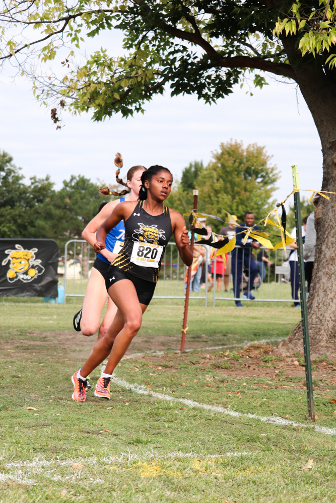 Placing sixth in the 5K, senior Sarah Bertry leads the women to third place overall. Bertry ran right behind five Tulsa runners, who placed first through fifth.