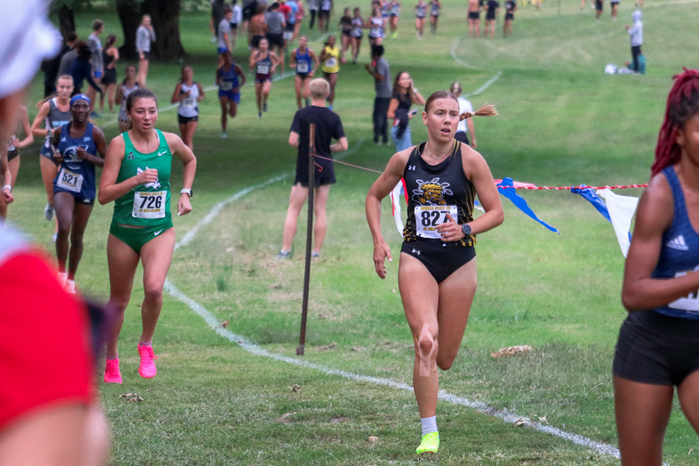 In the final lap, junior Lea Jerkovic works to catch up with the pack during the JK Gold Classic on Sept. 7. Jerkovic placed 24th in the women's 5K after setting a time of 18:47.58.