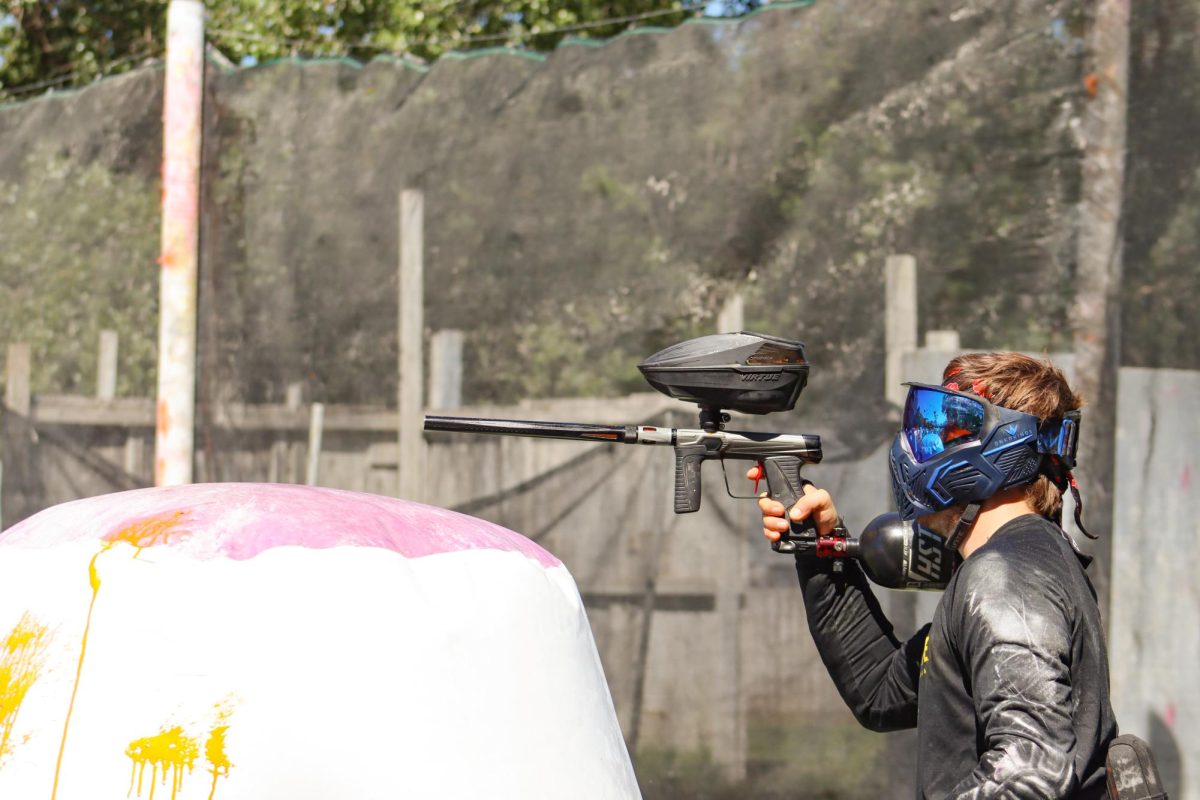 Junior Jordan Whitehurst takes a shot at an opponent. Wichita State's paintball club competes against other schools in various tournaments.