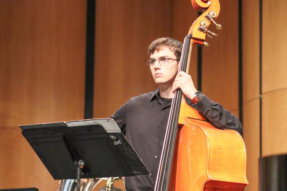 Senior John Koontz concentrates on the conductor during the WSU Wind Ensemble performance. The concert was held on Thursday, Sept. 12, at the Duerksen Fine Arts Center.