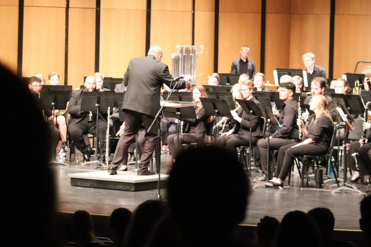 Timothy Shade conducts the Wind Ensemble on Sept. 12 before an audience. The ensemble performed a variety of pieces including "Morning Star," "Moving Paths," "Urban Pulse," "Rising Light," and "Zion."