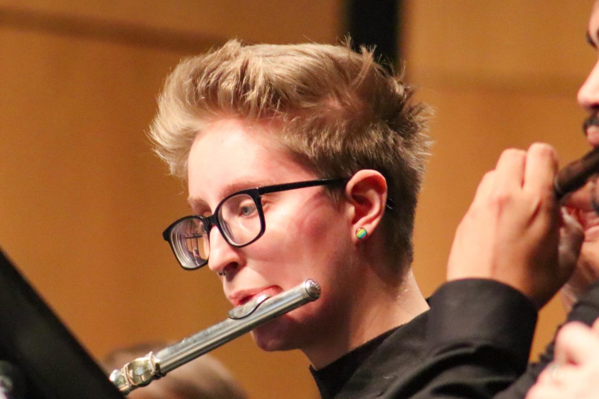 Graduate student Hannah Kavanaugh plays the flute during the Wind Ensemble performance on Sept. 12. The Wind Ensemble was recently honored as a national finalist for The American Prize.