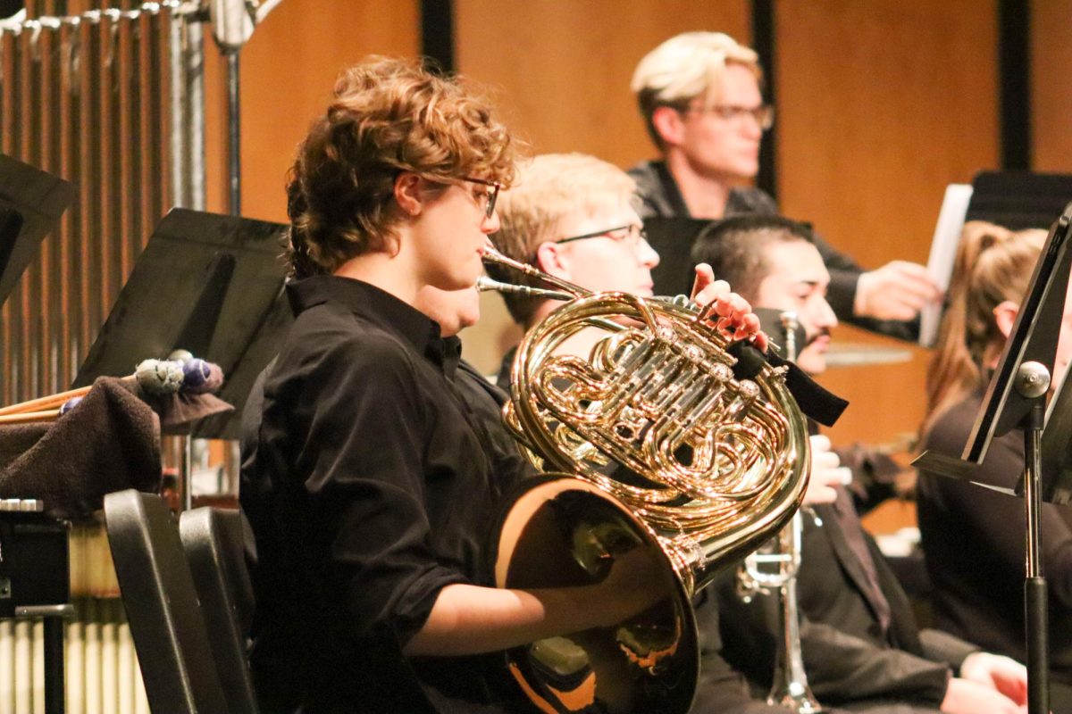 Undergraduate student, Grace Schulze practices before the Wind Ensemble performance on Sept. 12. On Thursday, the Wind Ensemble took the stage for its first performance of the year.