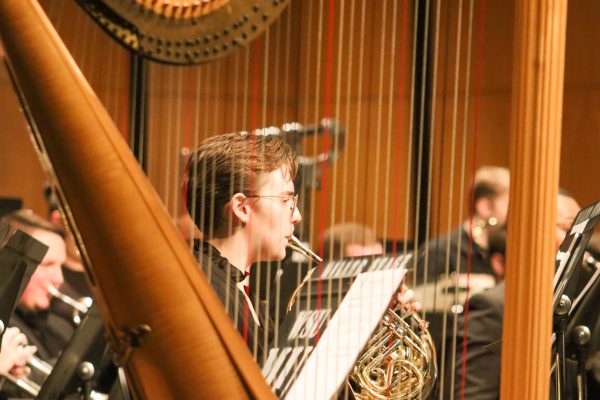 Jett Calderon, a 2023 graduate, plays the flute during a WSU Wind Ensemble performance on Sept. 12. The ensemble presented five different pieces at Miller Concert Hall in the Duerksen Fine Arts Center.