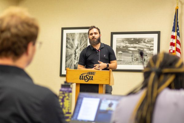 Andrew Bobbitt, SGA graduate senator, talks to the other representatives about the importance of parking on campus. "We need to prioritize student parking over visitor parking." said Bobbitt. "Growing pains with this new system have proven that a little bit of wiggle room is more than appropiate."